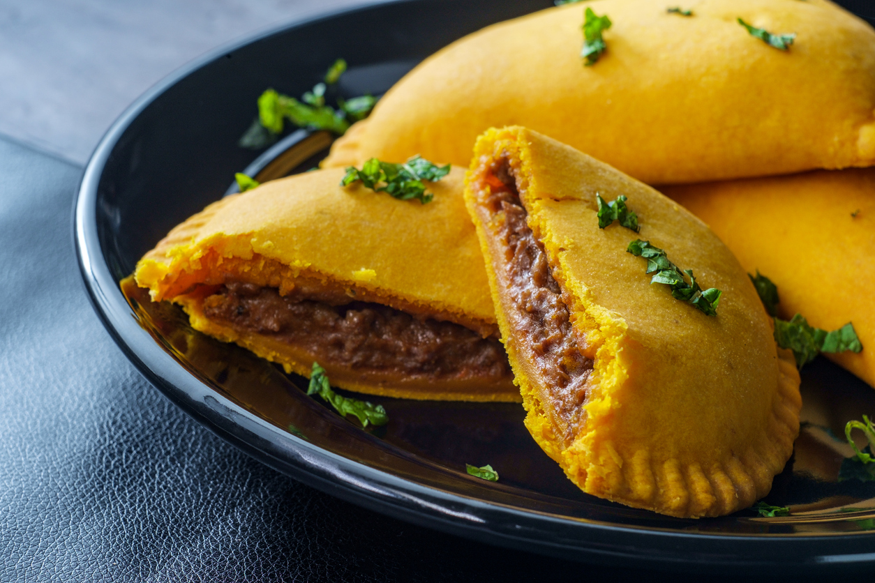 Authentic Jamaican street food beef patties with flaky golden pastry and spiced meat filling in Montego Bay
