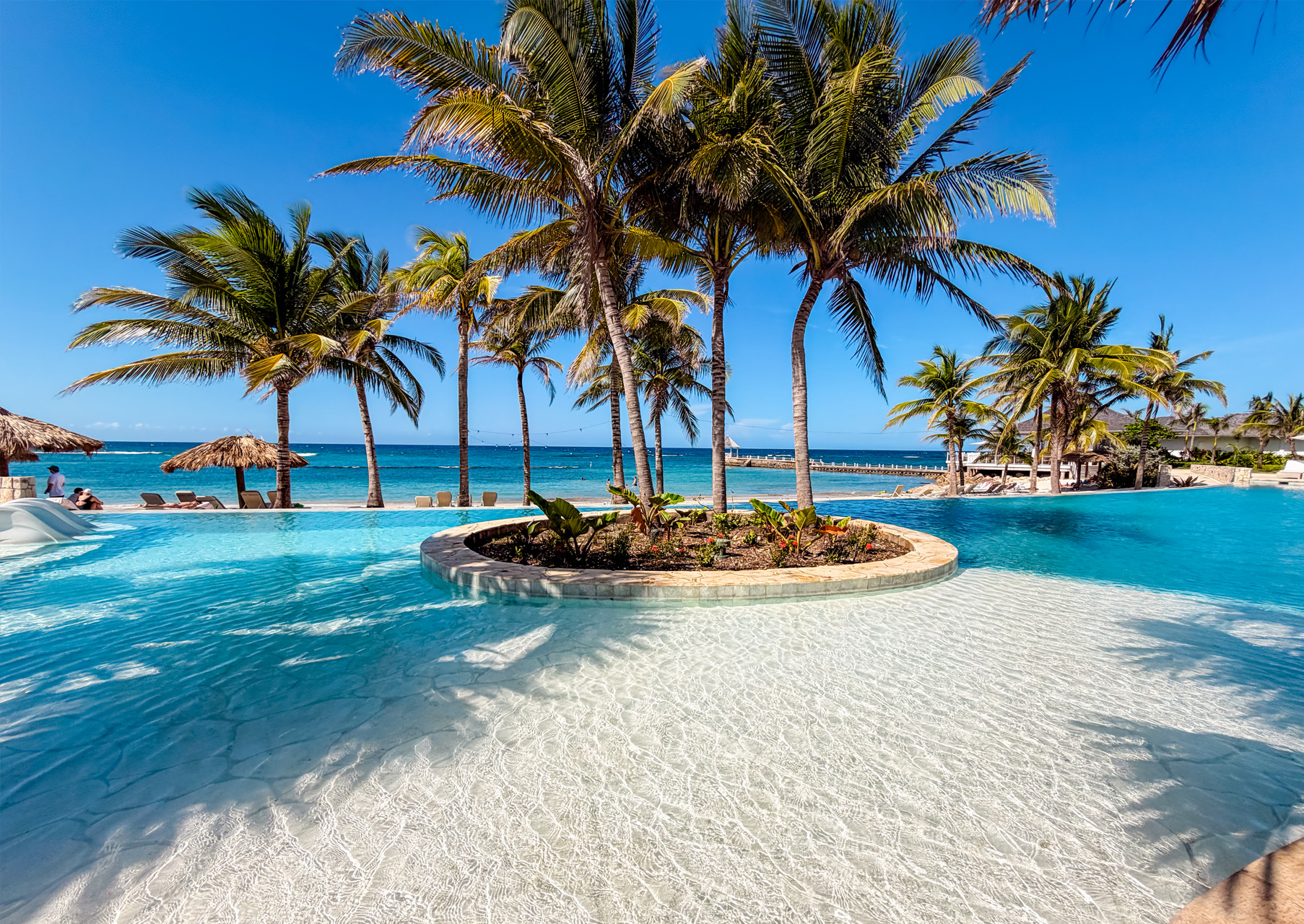 Massage-latest Outdoor couples spa treatment table overlooking the Caribbean Sea at Tryall Club, at Round Hill Resort in Montego Bay Jamaica.
